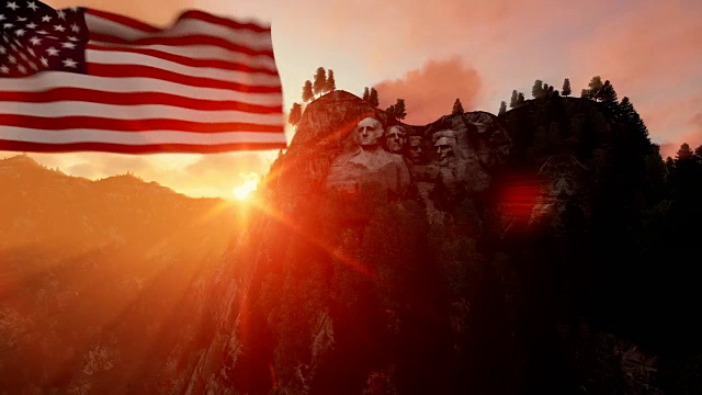 美国国旗迎风飘扬的拉什莫尔山，美丽的日出视频下载