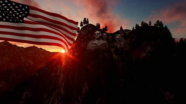 在风中飘扬着美国国旗的拉什莫尔山，缓缓升起的日出视频下载