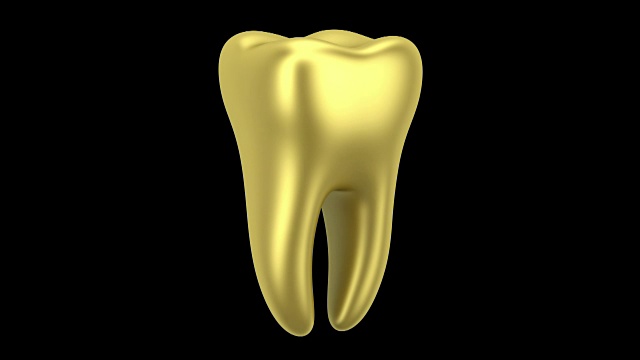 金色的人类牙齿环在黑色背景上旋转视频素材