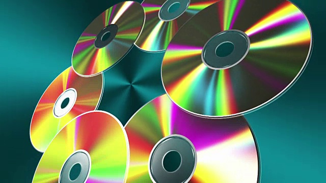 旋转的CD-DVD光盘在蓝色的背景。无缝循环。视频下载