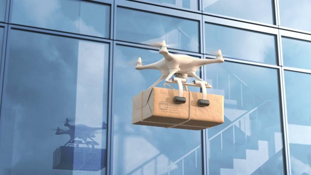 四轴飞行器(Quadcopter)在一栋办公大楼旁投递邮件视频素材