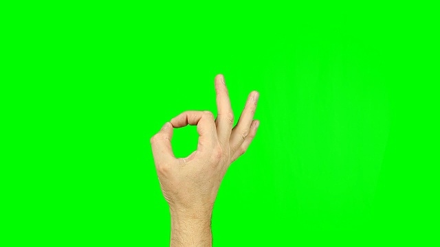 好，在绿色屏幕上做手势。表示同意、同意或一切都很好。拇指和食指围成一个圆圈。素材包含纯绿色，而不是alpha通道，容易按键。视频下载