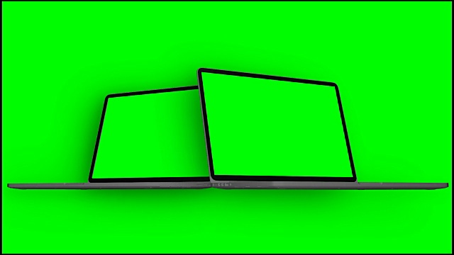 4 k的视频。两台笔记本电脑在绿色背景的绿色屏幕下开机。视频下载