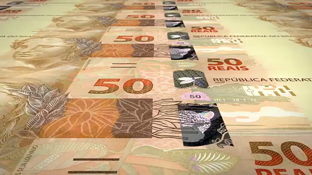 50巴西雷亚尔钞票在屏幕上滚动，现金，循环视频素材