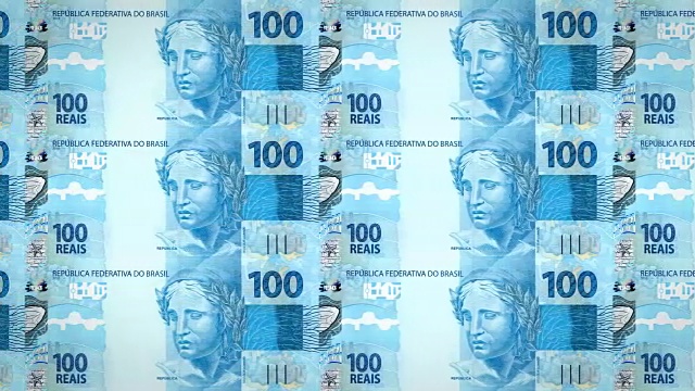 屏幕上滚动着一百巴西雷亚尔的钞票，现金，循环视频素材