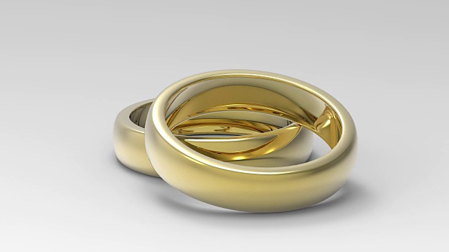 结婚戒指旋转孤立的白色背景。三维渲染视频下载