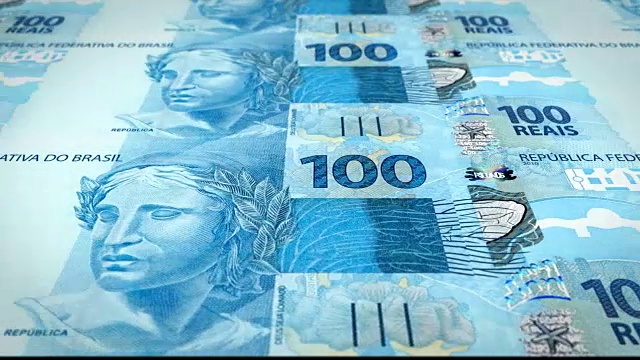 巴西银行的百雷亚尔系列钞票在屏幕上滚动，硬币的世界，现金的钱，循环视频素材