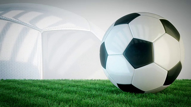 草地上的旋转光滑足球-无缝循环视频素材