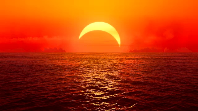日落和日食在无缝循环的海洋上。视频下载