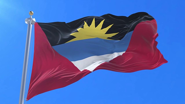 安提瓜和巴布达的旗子在风中缓缓飘扬，随着蓝天缭绕视频下载