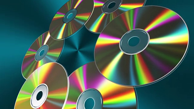 旋转CD-DVD光盘在蓝色背景。4K。3840 x2160。无缝循环。视频下载