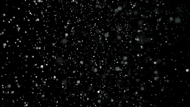 黑色背景上的慢动作雪视频素材