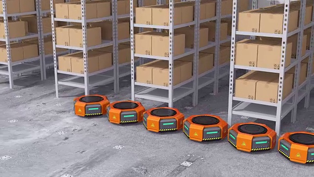 橙色的机器人搬运工在现代仓库里搬运货物视频素材