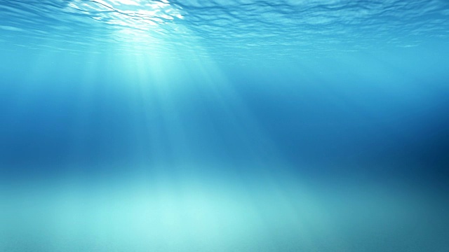 蓝色柔和的海浪，慢镜头循环的海洋表面从水下看到(4k，无缝循环)光线透过伟大的背景视频素材