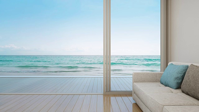 豪华公寓近玻璃门的木地板沙发，以海洋和天空为背景，休息室在现代海滩别墅或酒店的海景客厅视频素材
