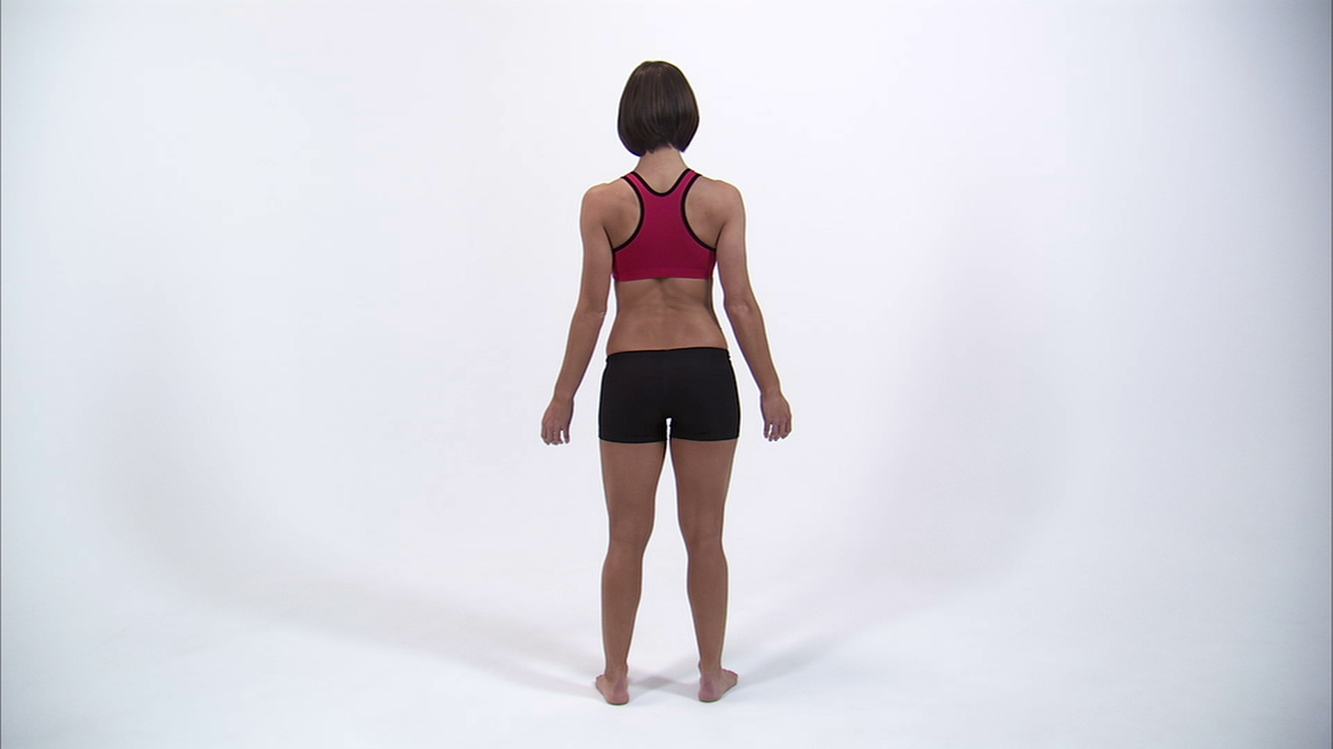 WS后方的年轻女性在运动胸罩与手在臀部/ Orem，犹他州，美国视频下载