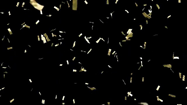 金色的五彩纸屑落在黑色的背景上。循环动画。视频素材