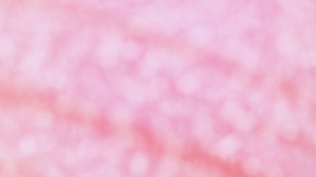 粉红色的背景，白色的散景和灯光视频素材