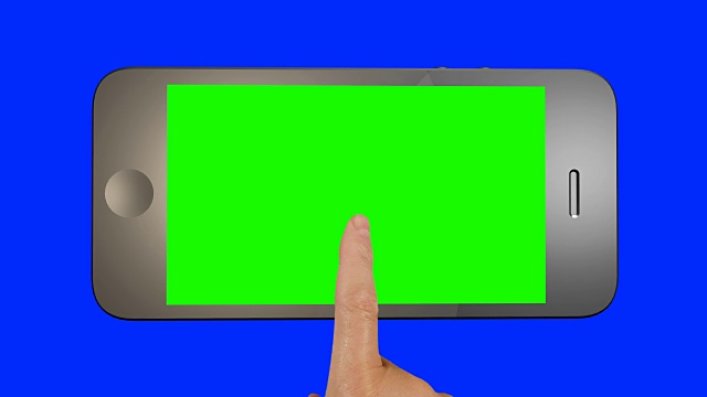 一个手指在智能手机的绿色屏幕上点击的特写。视频下载