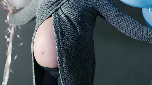 孕妇宝宝公告揭示男孩或女孩概念侧面剖面图的宝宝肚子视频素材