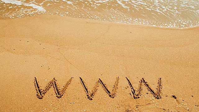 www这个词是手写在沙滩上的沙子上的视频下载