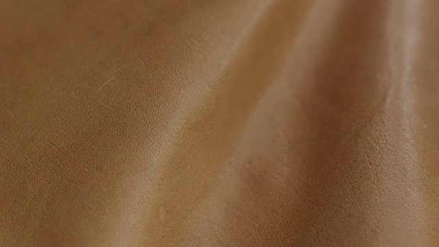 天然棕色皮革纹理背景。抽象复古牛皮背景设计。视频下载