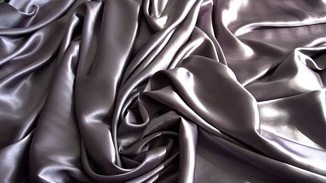 背景纹理柔软的银色织物织物材料反向移动。视频素材