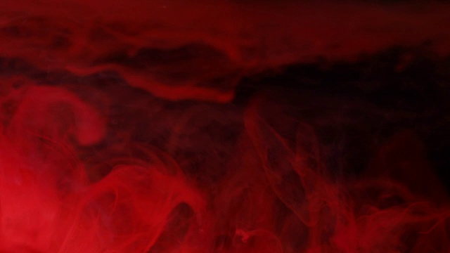 抽象的红色艺术墨滴在黑水里视频素材