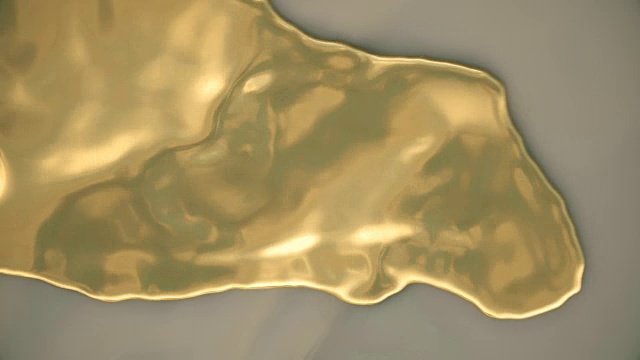俯视图动画描绘液体黄金滚动到岸上。视频下载