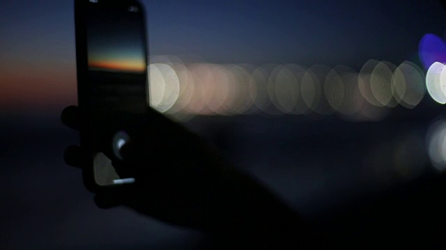 在海滩上拍摄日落全景照片视频下载