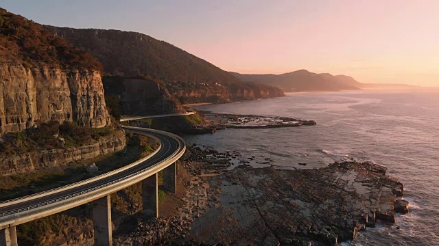 澳大利亚航拍新南威尔士州日出海悬崖桥海岸景观视频素材