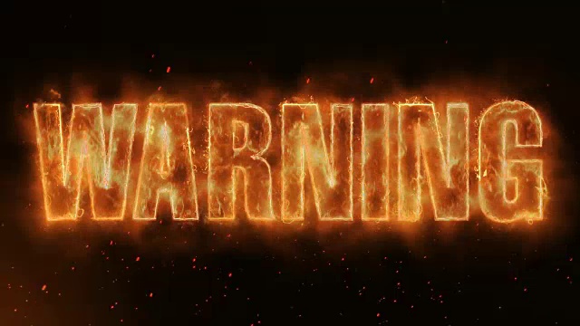 警告词热燃烧在现实的火焰火焰火花和烟雾连续无缝循环动画视频素材