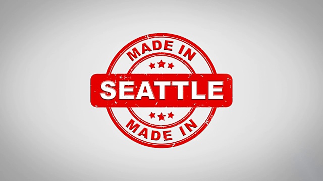 西雅图签名盖章文本木制邮票动画。红色墨水在干净的白纸表面背景与绿色哑光背景包括在内。视频下载