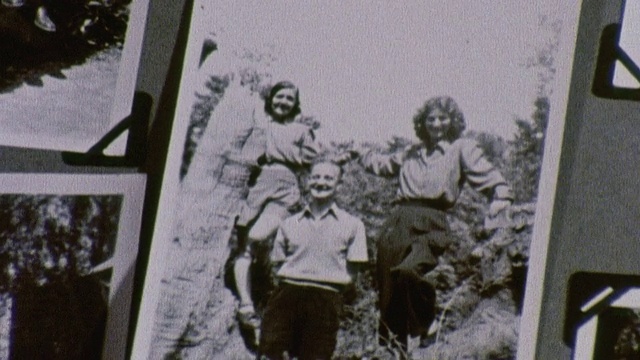 1978蒙太奇祖母展示年轻妇女的老照片和讨论她的生活/英国视频下载
